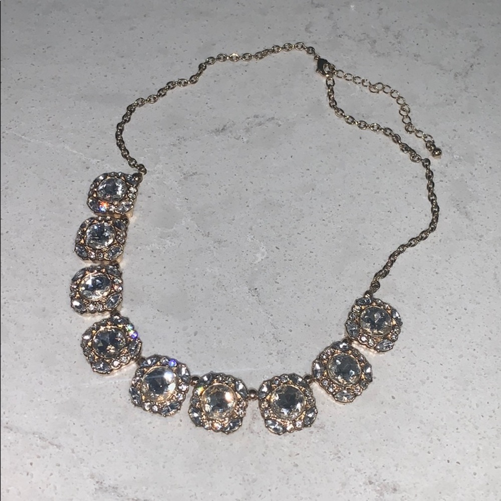 Gold collar necklace with stone clusters
